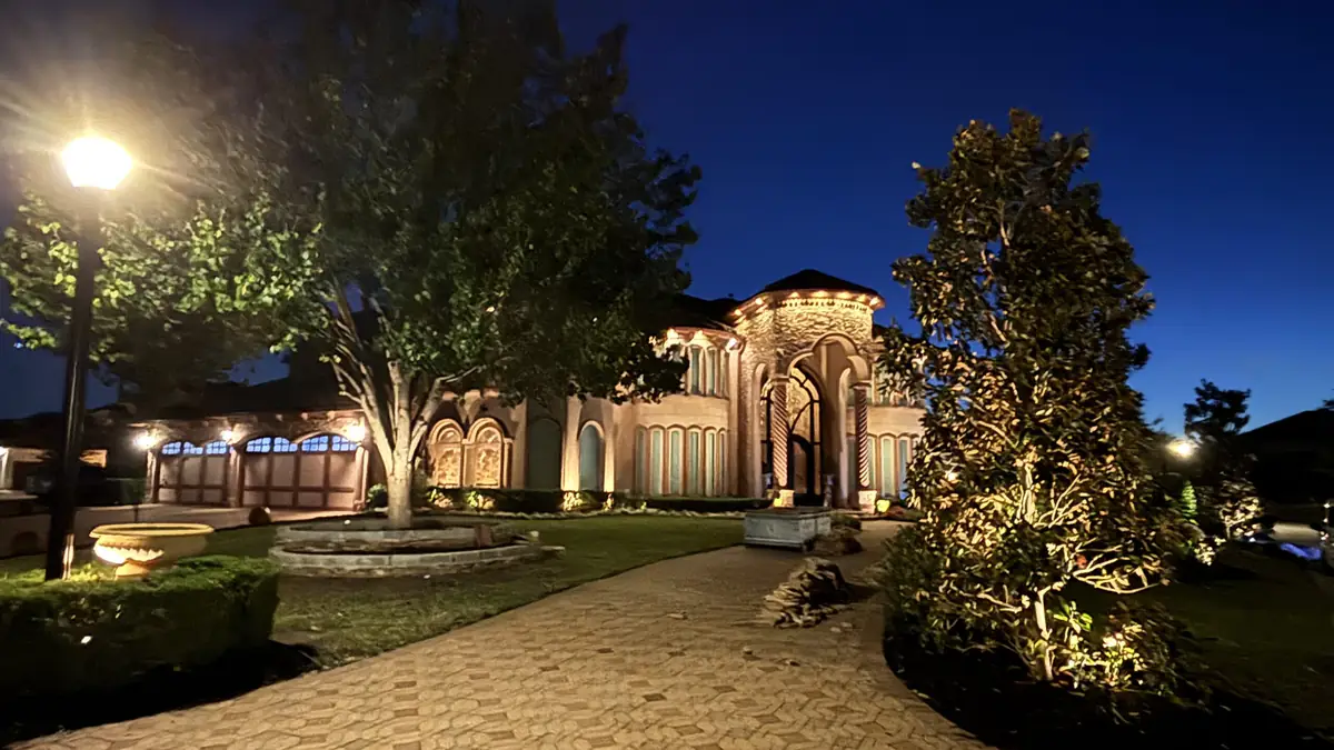 Landscape lighting on a Fulshear, Texas home at night